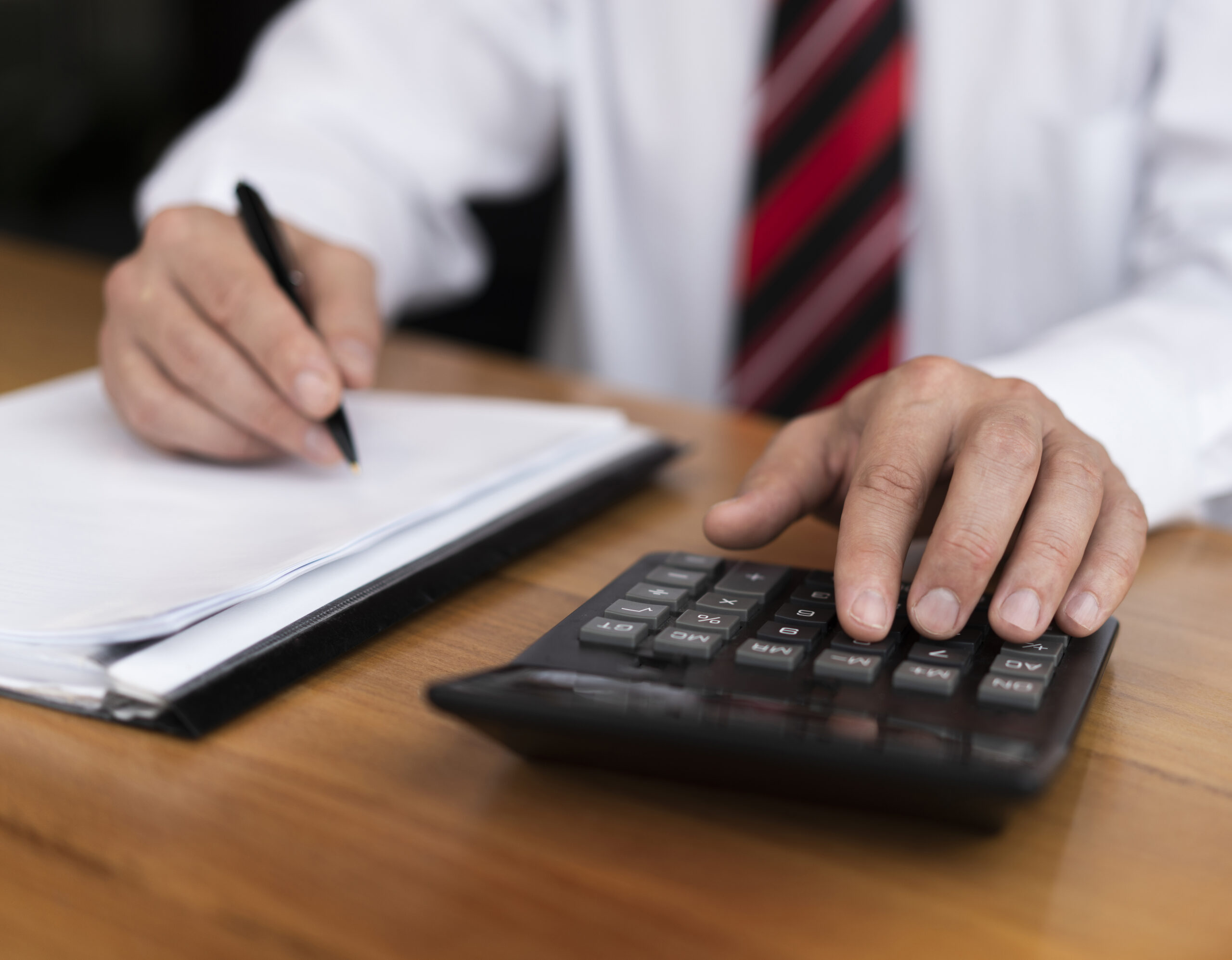 professional-man-typing-numbers-calculator